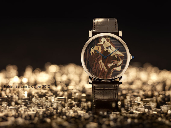 Montre Rotonde de Cartier, décor lion, marqueterie de paille